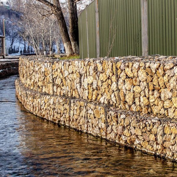 Versatile welded wire mesh gabion fence designed to provide support for retaining walls landscaping and perimeter security