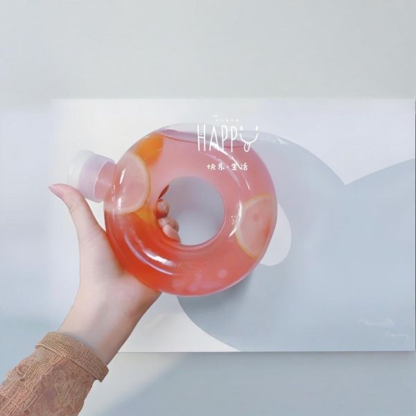 Buy Custom Shape Plastic Juice Bottle 550ml PP Donut Shaped Juice PETG Milk Tea Plastic Bottle with Pull Ring Lid at wholesale prices