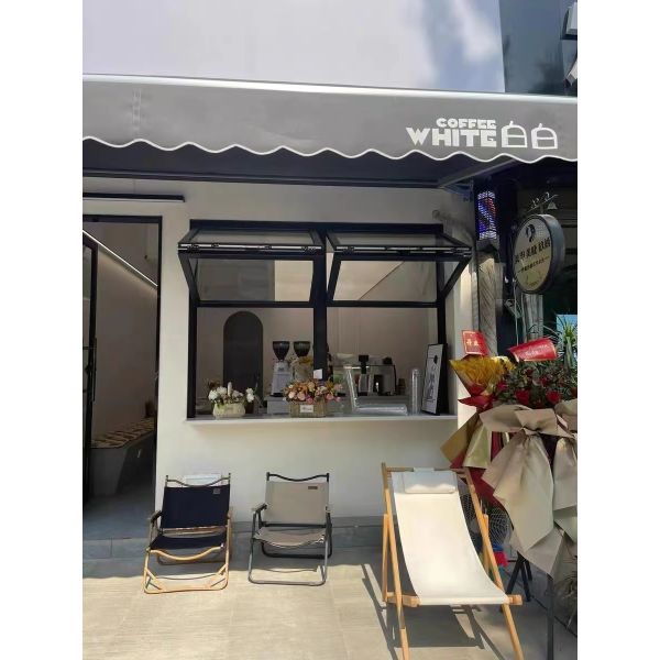 Slim-Profile Frameless Folding Window Illusion Creating Near-Invisible Transitions Between Interior and Deck Areas