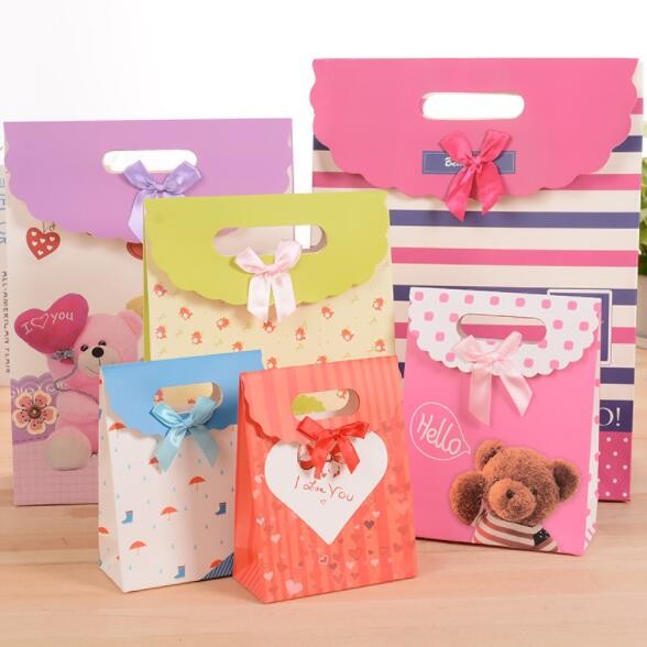 Buy Customized pattern Cardboard Gift Bags 24x10x32cm With Handle Bow Knot at wholesale prices